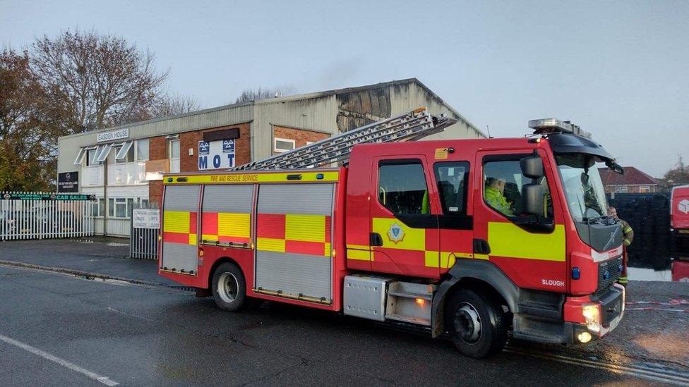 Fire engine outside MOT tyre centre following fire