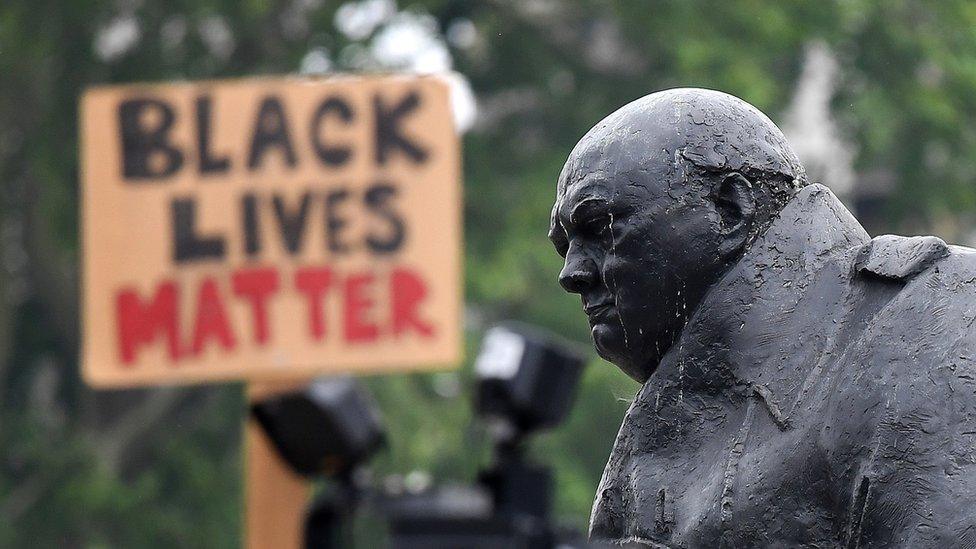 Statue of Churchill in Parliament Square with Black Lives Matter sign