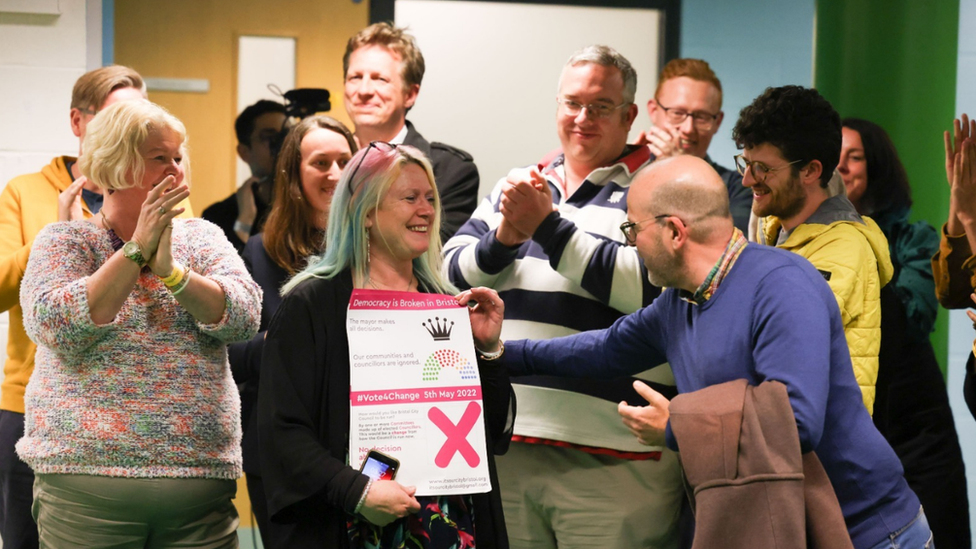 Jubilant members of the Scrap the Mayor campaign after the results of the Bristol mayoral referendum were announced