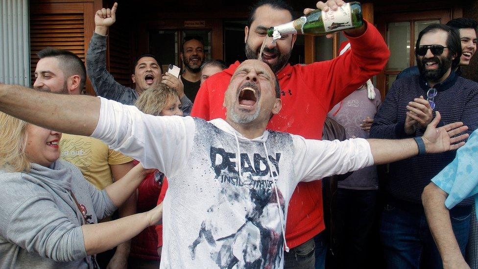 Clients of the Restaturant "Pepe" celebrate in San Vicente del Raspeig, Alicante, Spain, after winning the first prize.