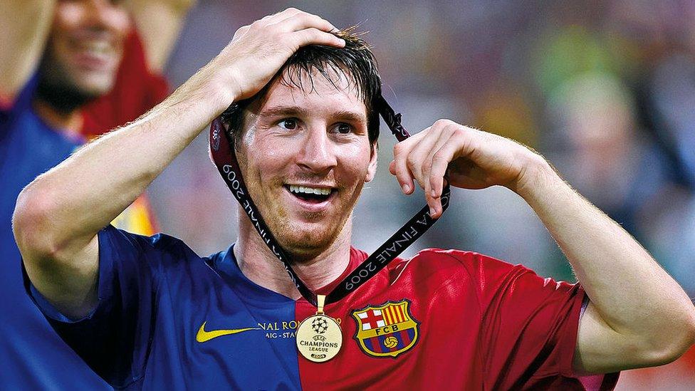 Messi with his winners medal.