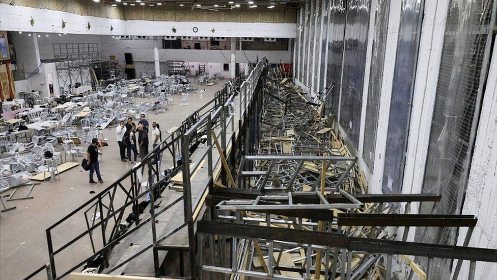 A view inside a synagogue where tiered seating collapsed during a religious celebration in Givat Zeev, in the occupied West Bank, May 16, 2021