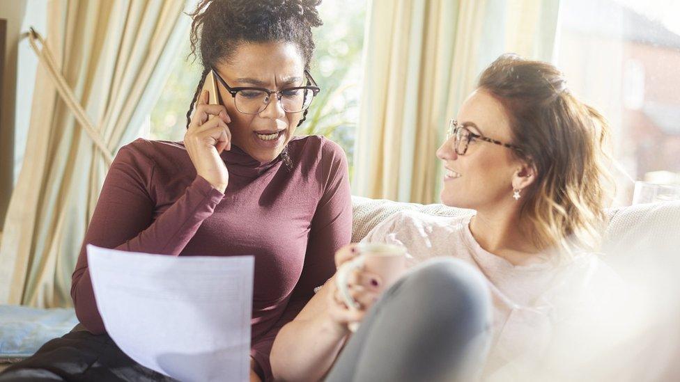 Woman on phone discussing energy bill