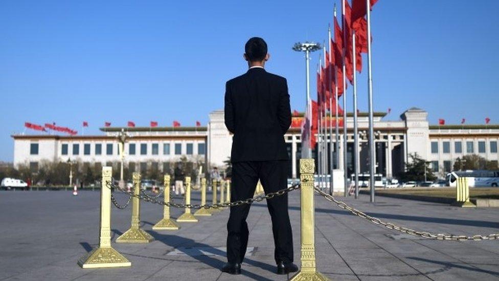 A security guard stands on Tiananmen Square during the second plenary session of the National People's Congress at the Great Hall of the People in Beijing (09 March 2016)