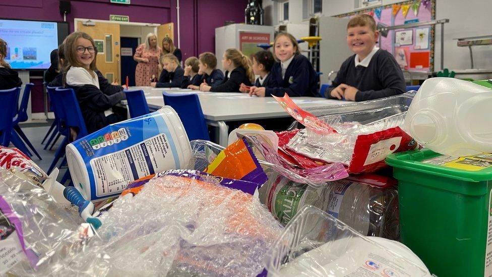 Primary school pupils sorting plastics