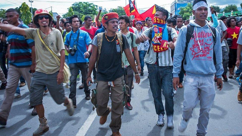 East Timorese activists head toward the Australian embassy during a rally in Dili on February 23, 2016