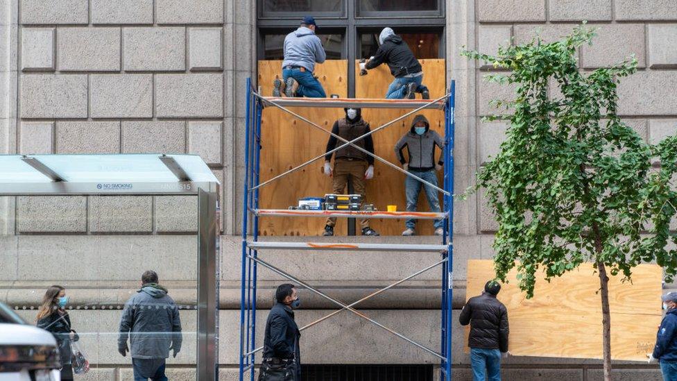 Businesses in New York City are boarding up their shop fronts in case of post-election unrest