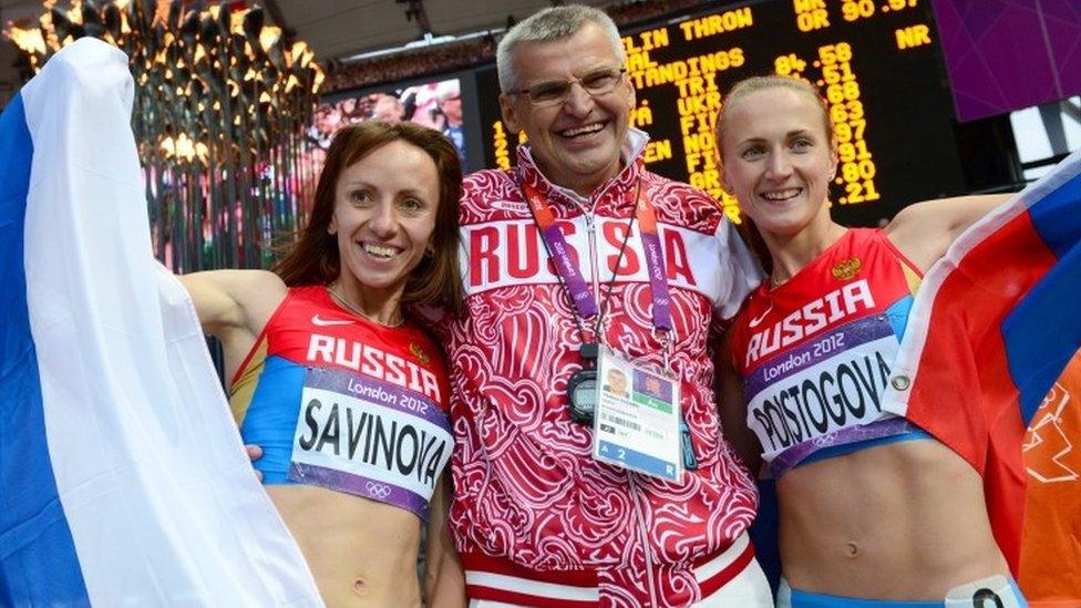 Russia's gold medallist Mariya Savinova (left) celebrating with bronze medallist Ekaterina Poistogova (right), and Russian coach Vladimir Kazarin, at the end of the women's 800m final at the athletics event of the London 2012 Olympic Games