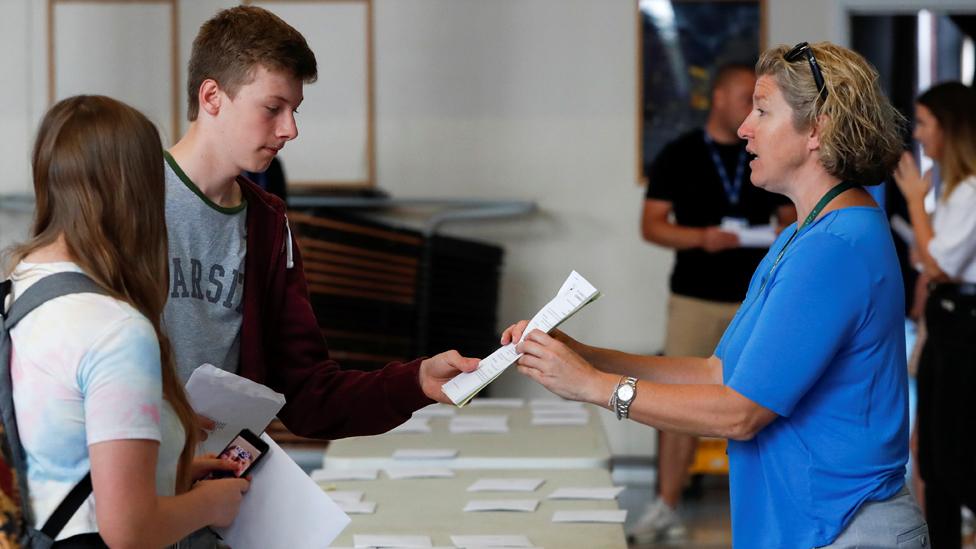 Students being given results