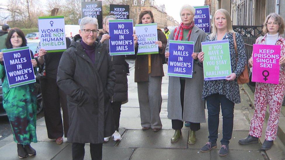 Former governor Rhona Hotchkiss with protestors