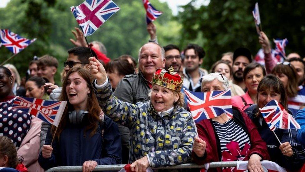 People waving flags on The Mall