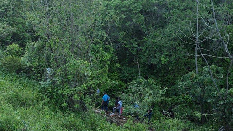 The ravine where the bus crashed