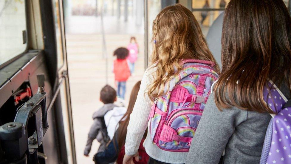 Pupils getting off school bus