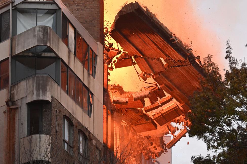 A wall collapses during a building fire in the Central Business District of Sydney, Australia, 25 May 2023.