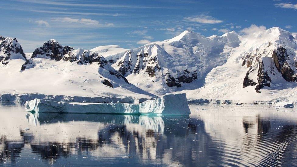 Mountains and ice on sea in Antarctica