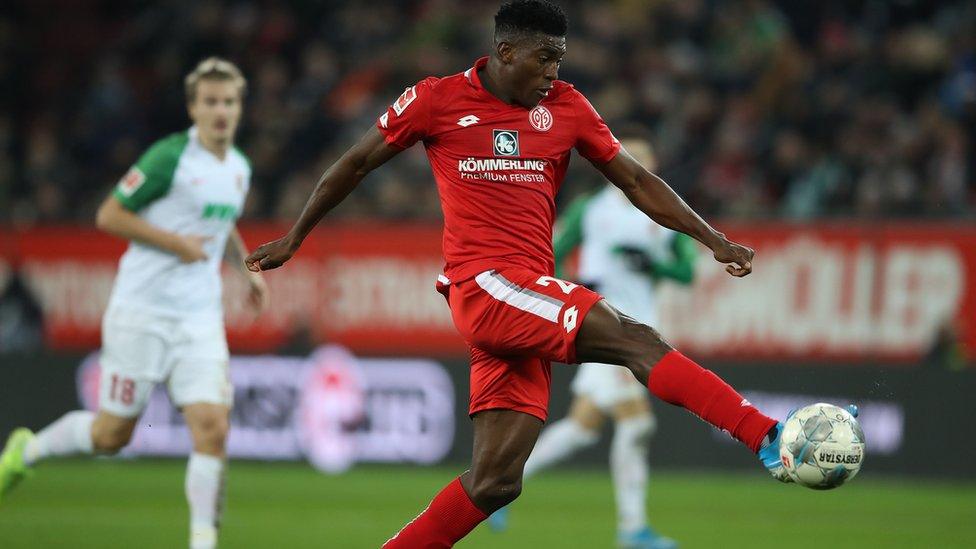 Taiwo Awoniyi of Mainz runs with the ball during the Bundesliga match between FC Augsburg and FSV Mainz 05