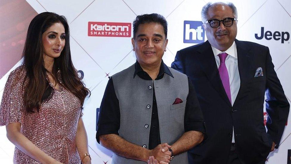 Indian actors Sridevi (L), Kamal Haasan (C) and producer Boney Kapoor (R) pose for a picture as they attend the "HT India"s Most Stylish Awards 2018" in Mumbai late on January 24, 2018.