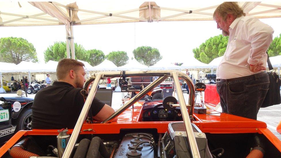 Tim Coleman (right) surveys a car