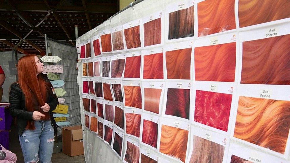 red heads looking at colour chart