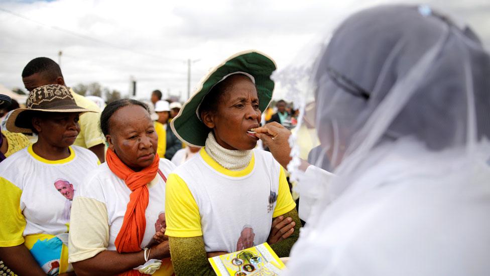 People receiving communion