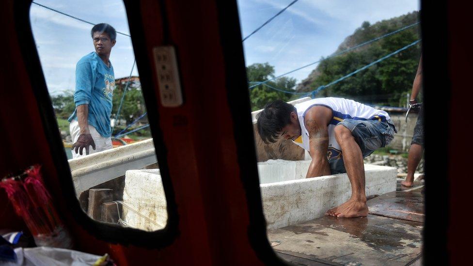 Filipino fishermen prepare and resupply their boat for another fishing trip to the Spratlys, on July 10, 2016 in Mariveles, Bataan, Philippines.