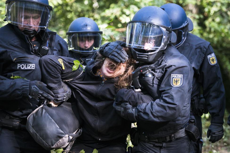 Police removing a protester in September 2018