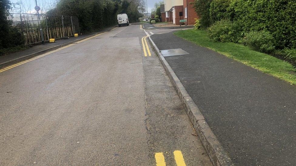 Locals are not sure if they can legally park in between the yellow lines