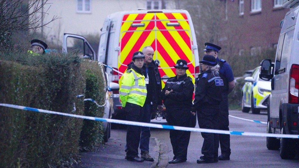 Police officers at the scene in Blaise Walk