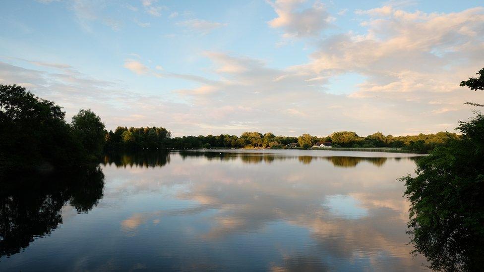 The sun prepares to set over Cosmeston Lakes in the Vale of Glamorgan, taken by Duncan McKellar