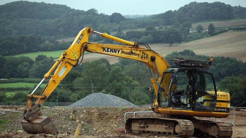 Big digger on edge of countryside