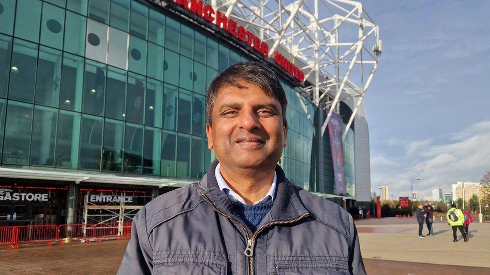 Fan outside Old Trafford Stadium