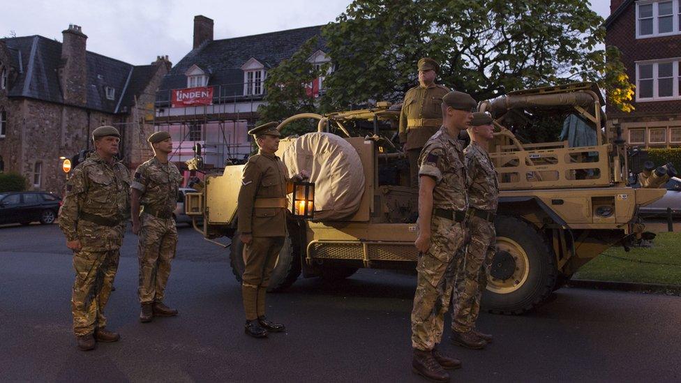 In Llandaff, a trench candle arrives before a ceremony at the city's cathedral