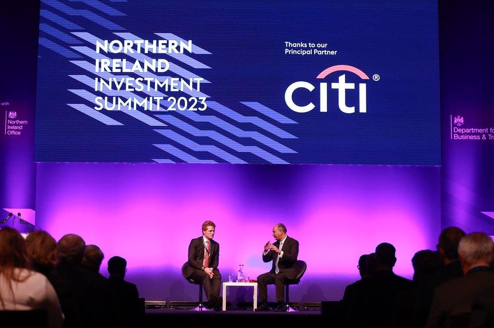 Two speakers on stage at the Northern Ireland Investment Summit in Belfast