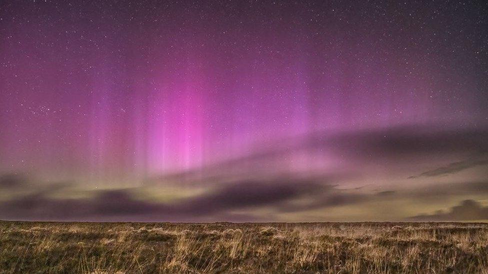 Northern Lights glowing pink over Exmoor from a point near Lucott Cross, Exmoor National Park