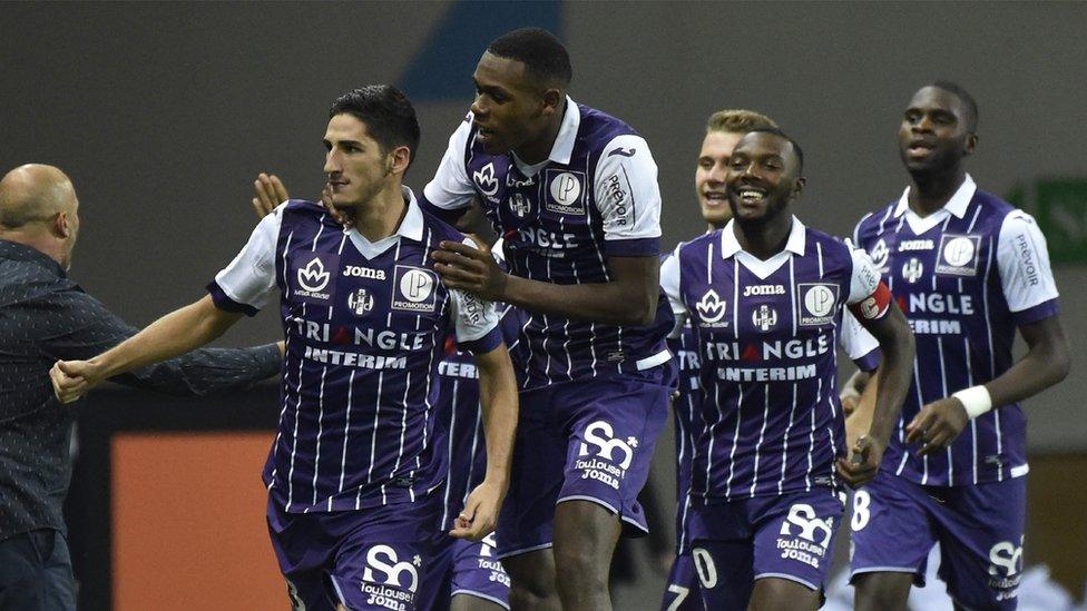 Yann Bodiger (left) celebrates giving Toulouse the lead against Paris St-Germain