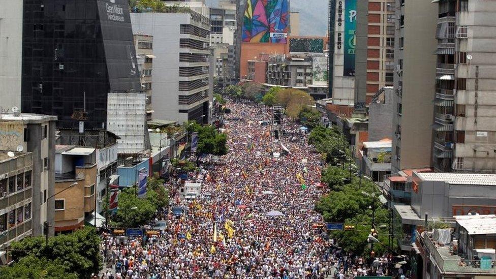 People participate in an opposition rally in Caracas, Venezuela 8th April 2017