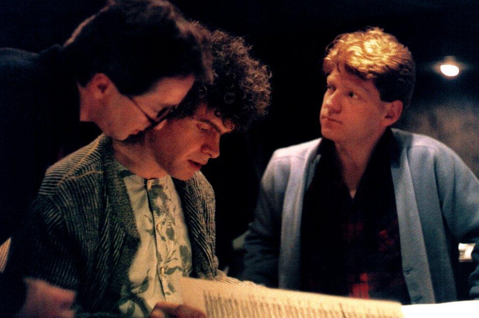 Patrick Doyle, Sir Simon Rattle and Sir Kenneth Branagh study the score for Henry V, Doyle's first film project