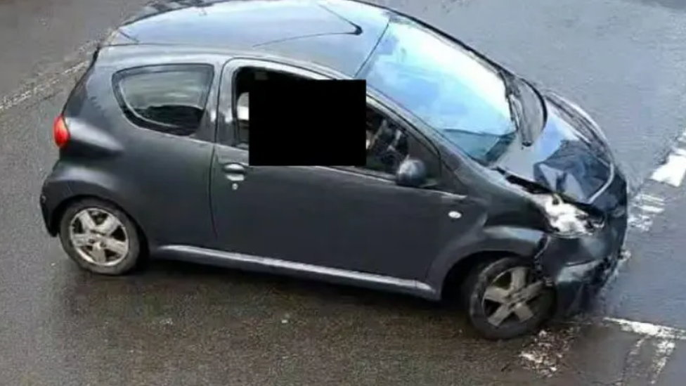 Damaged grey Toyota Aygo