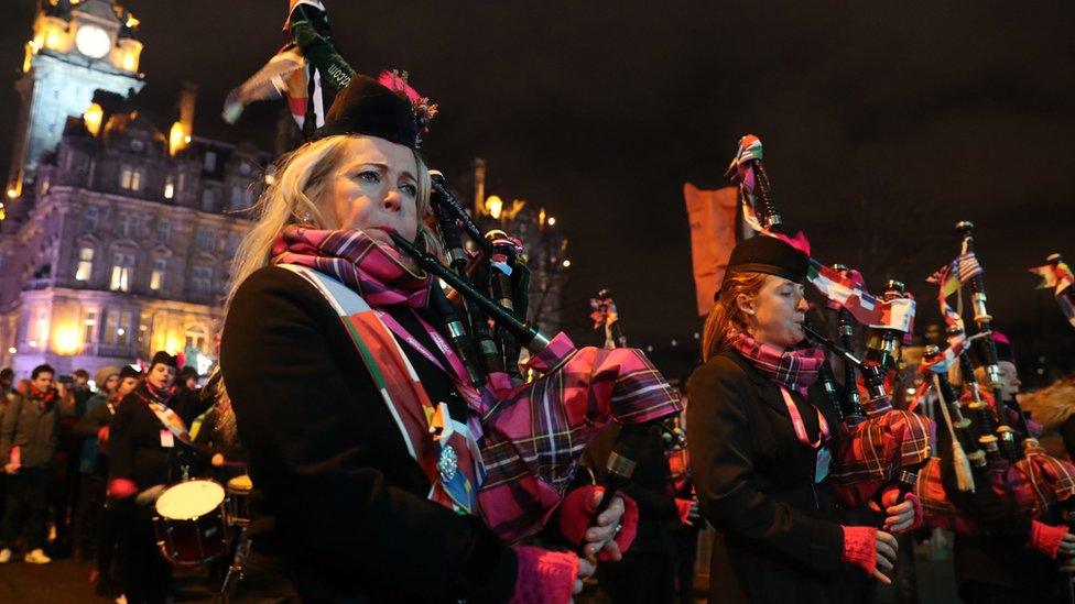 Members of the Divas and District Pipes and Drums perform on Princes Street during the Hogmanay New Year celebrations in Edinburgh