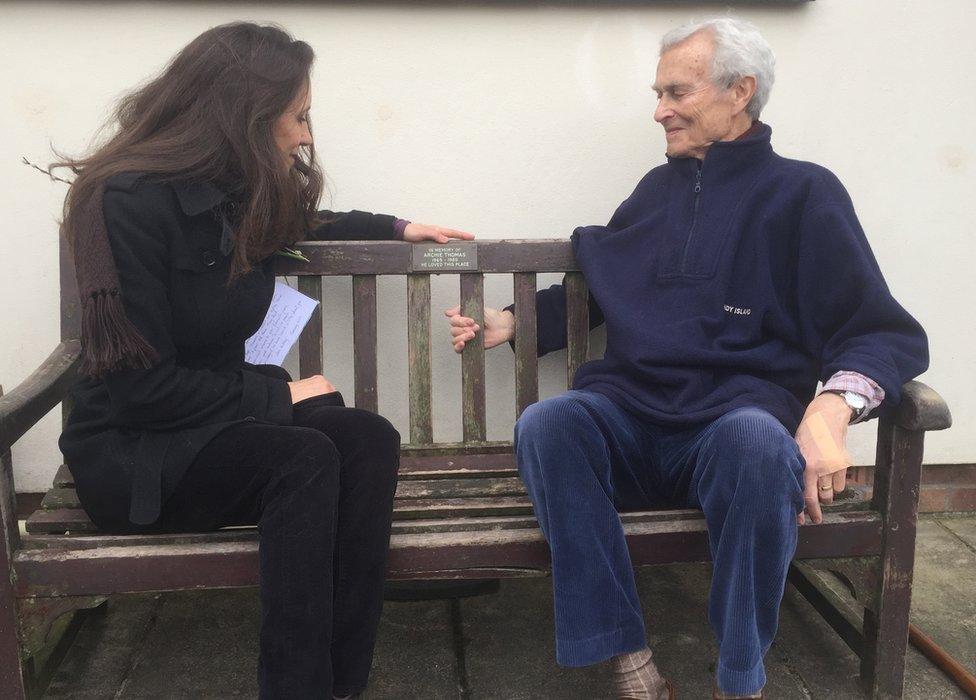 Archie Thomas' sister Emily and father Michael sitting on his memorial bench