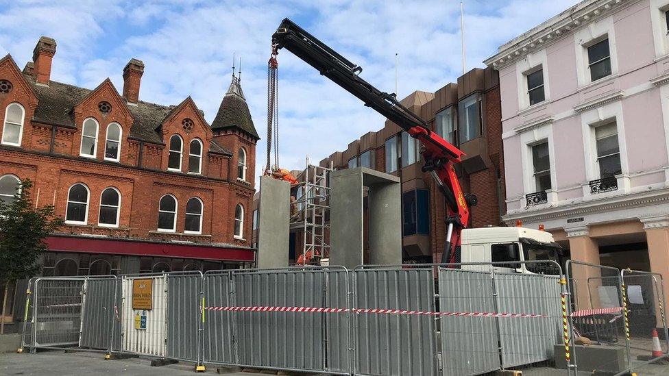 A crane lifting up the blocks