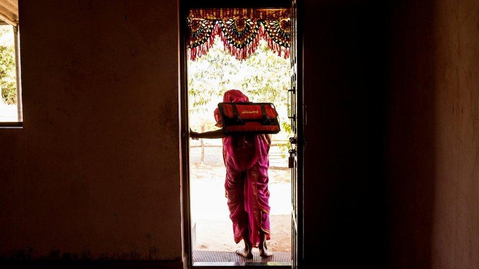 woman with backpack leaving