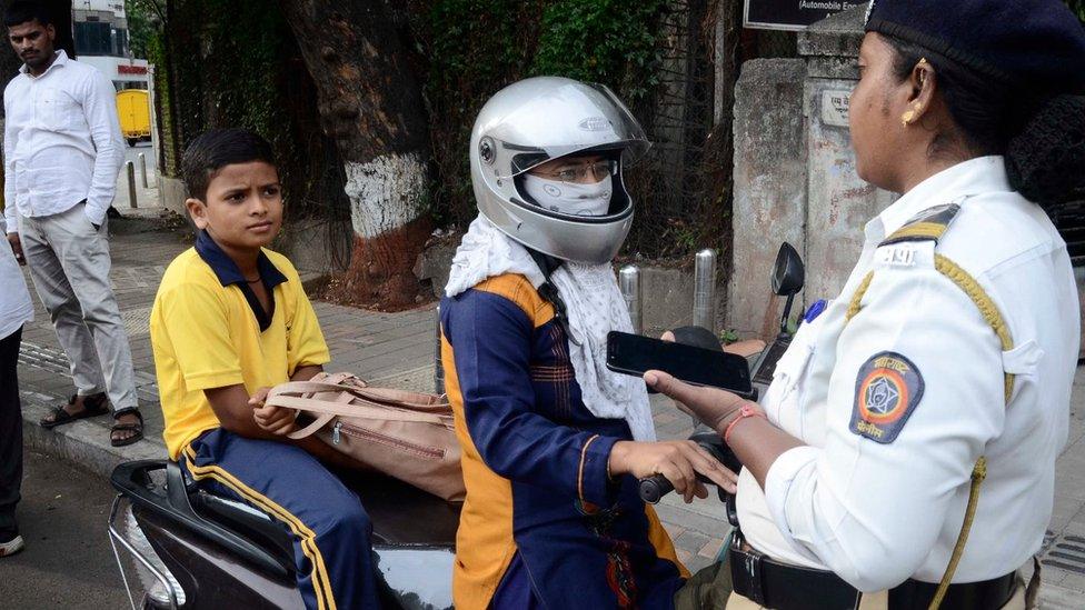 Police in Pune checking motorbike riders