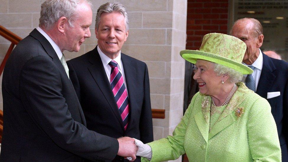 Martin McGuinness shakes hands with the Queen.