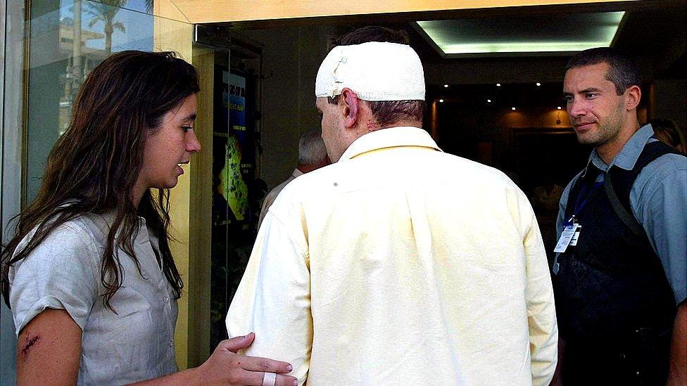 United Nations workers, Elpida Rouka (L), Darko Hocibob (C) and a bodyguard for UN representative in Iraq, Sergio Vieira de Mello, in eastern Baghdad, 19 August 2003