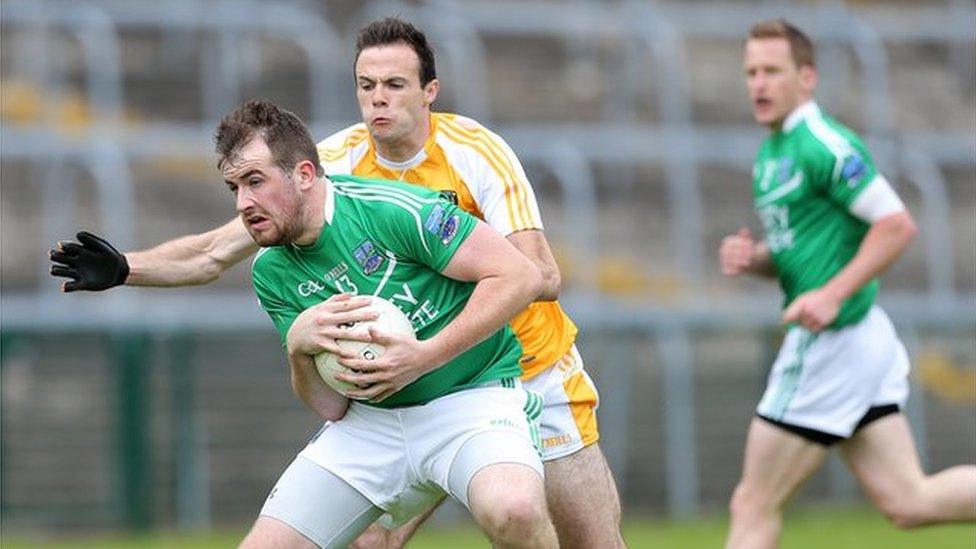 Fermanagh's Sean Quigley in action against Ricky Johnston of Antrim