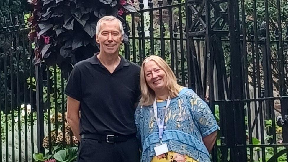 David King and Tracy Rudling in front of Holy Trinity Church