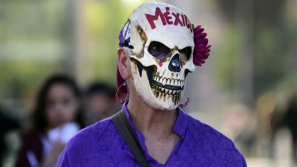 A woman takes part in a march on 19 October 2016 in Mexico City