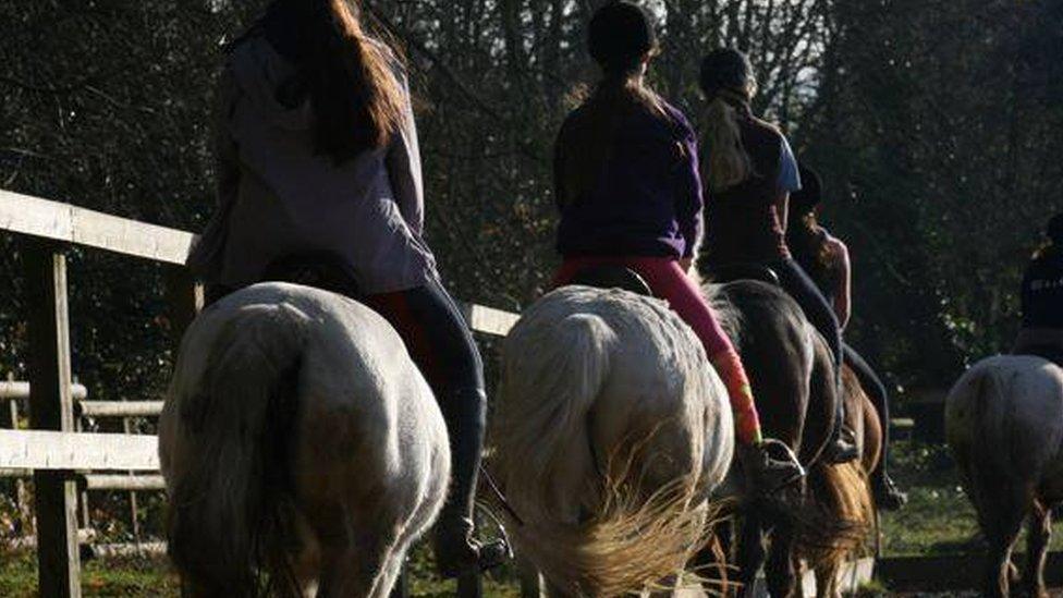 Children riding horses at Summerfield Stables.