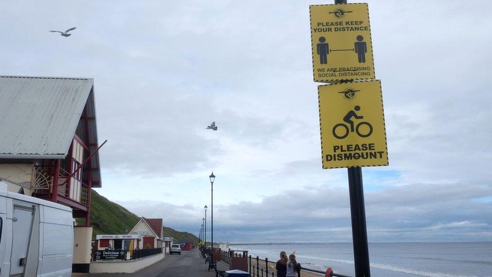 Social distancing signs on Saltburn Promenade